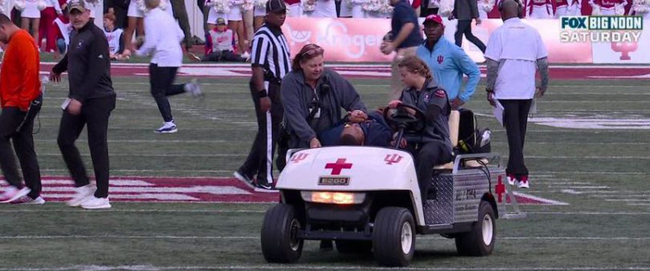 Michigan assistant Mike Hart collapses, carted off field at Indiana; Wolverines players consoled