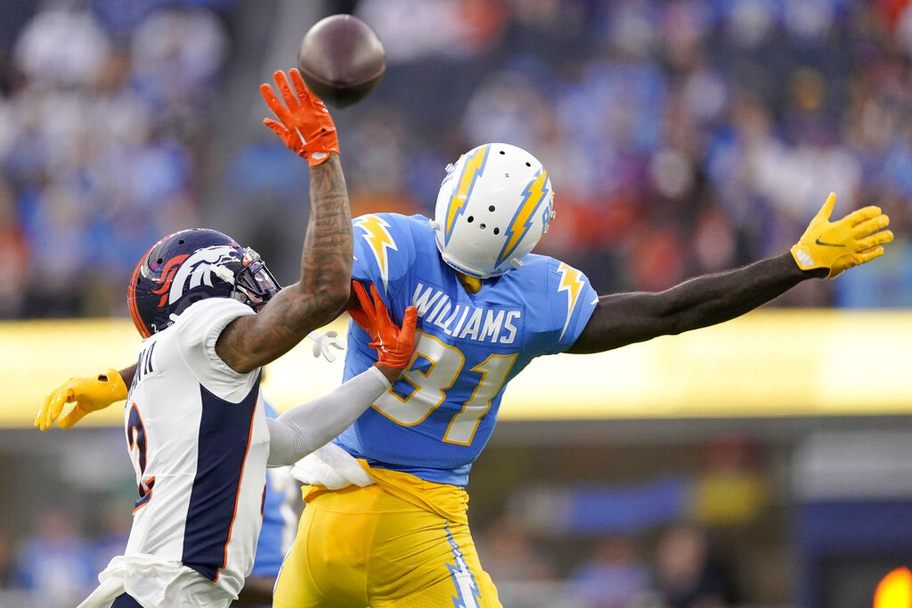 Broncos cornerback Patrick Surtain II breaks up a pass intended for Los Angeles Chargers wide receiver Mike Williams
