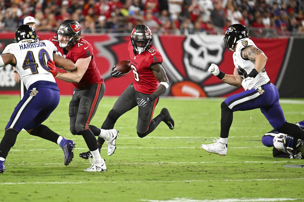 Buccaneers wide receiver Julio Jones carries the football