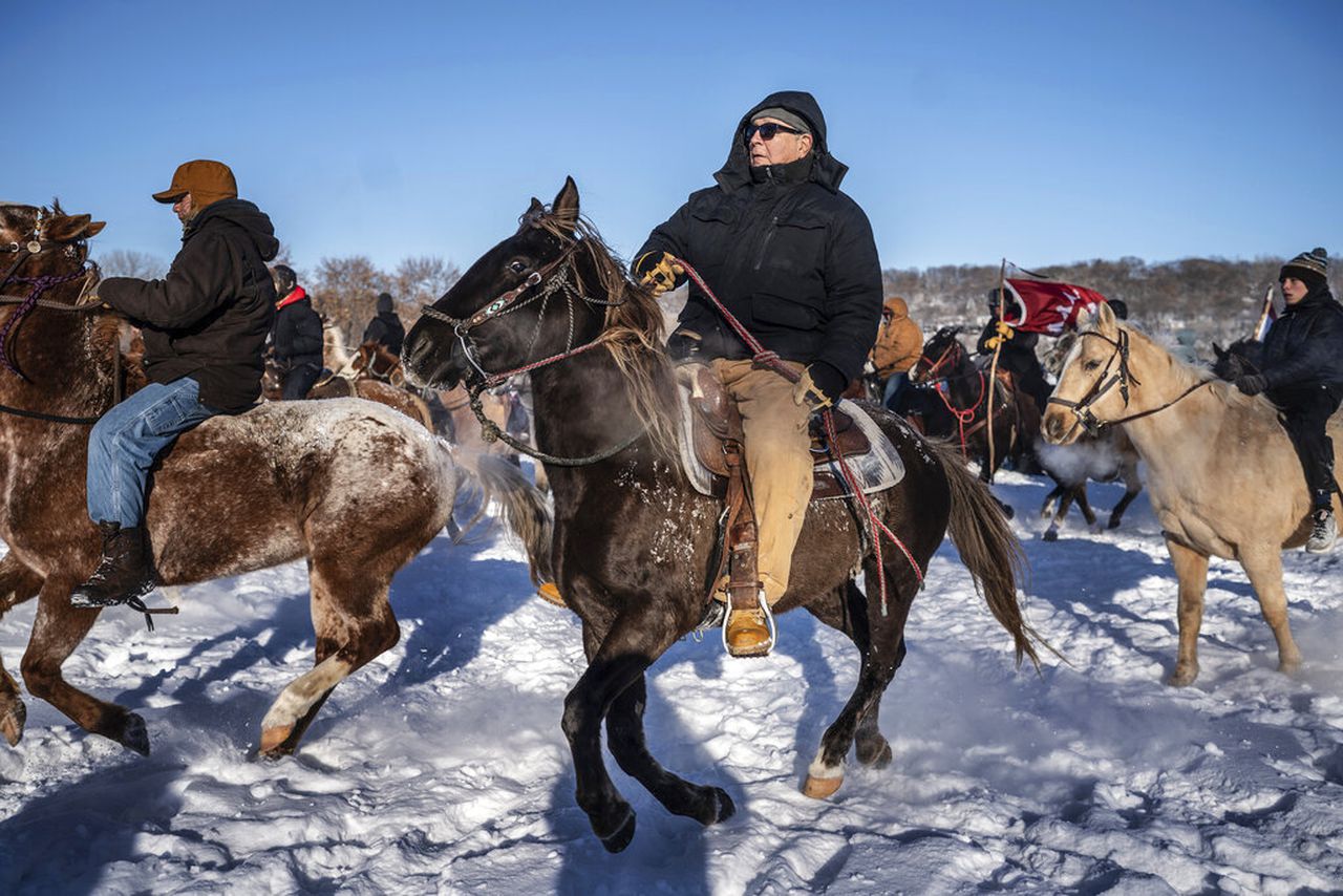 Riders complete 330-mile trip to honor victims of mass execution