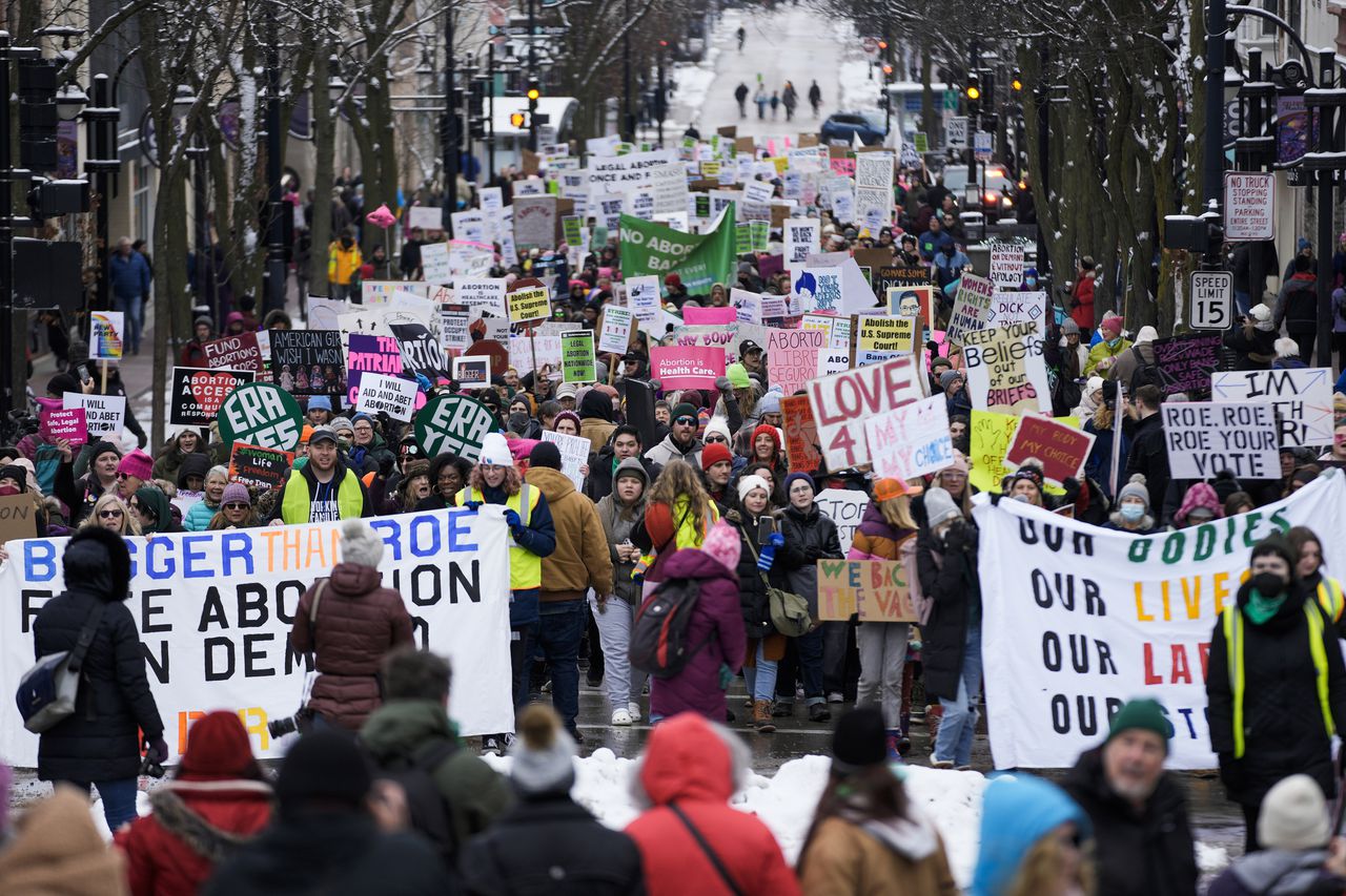 ‘Here again’: Abortion activists rally 50 years after Roe