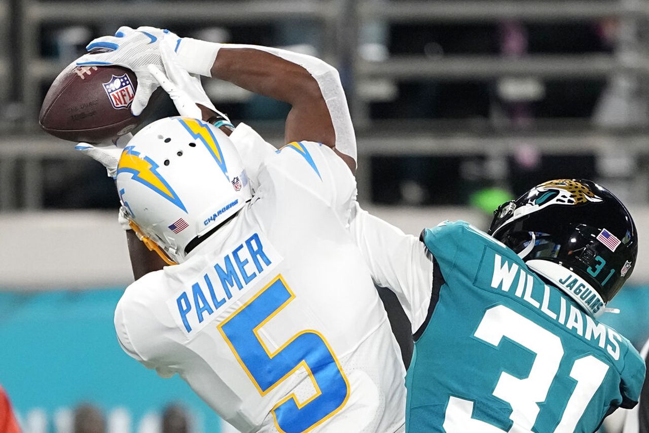 Jacksonville Jaguars cornerback Darious Williams and Los Angeles Chargers wide receiver Joshua Palmer battle for a pass