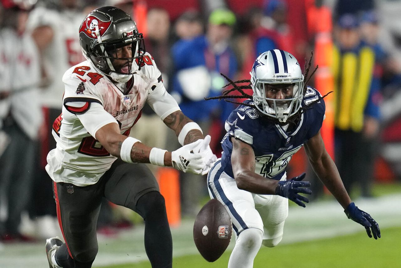 Tampa Bay Buccaneers cornerback Carlton Davis (24) and Dallas Cowboys wide receiver T.Y. Hilton battle for the football