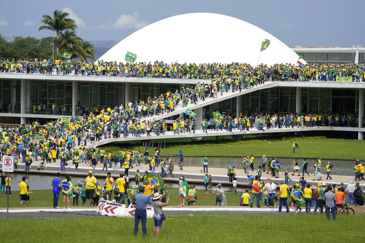 Supporters of former president storm Brazil’s top government offices