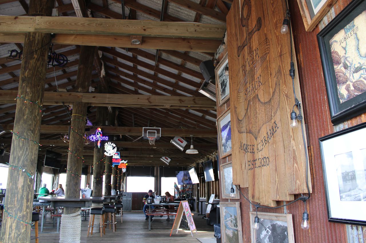 The River Shack is a waterfront venue at the mouth of Dog River. After a couple of dormant years, it reopened under new ownership in 2021.