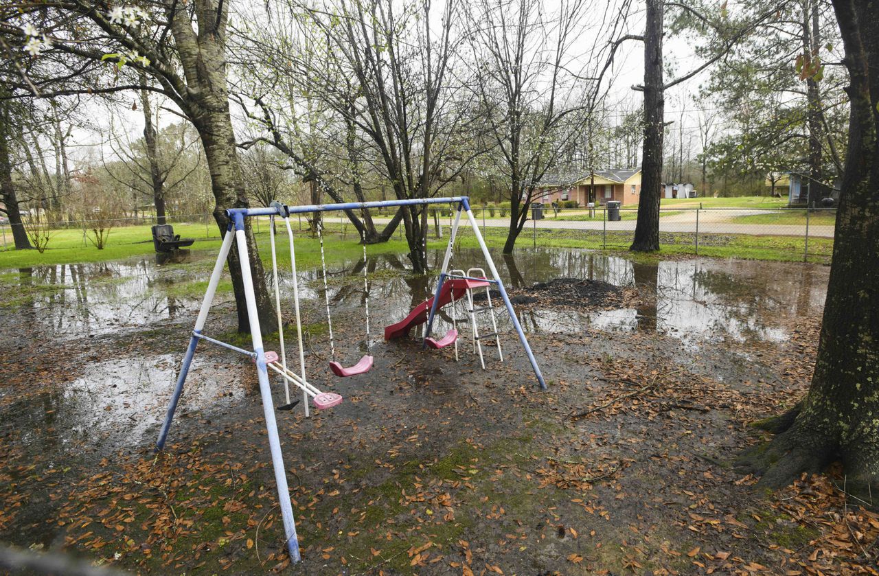 How a news photo of an Alabama swingset in sewage inspired Biden to take action