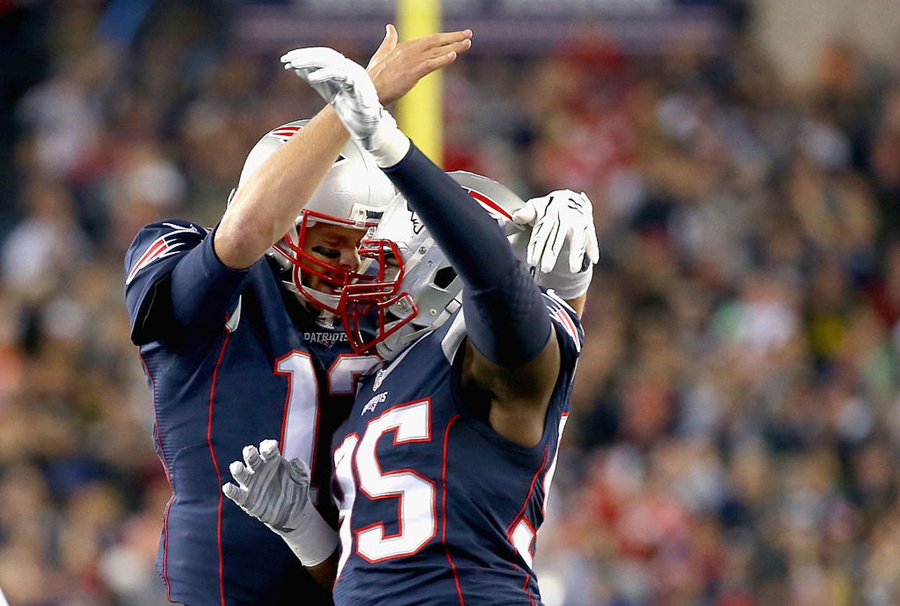 New England Patriots quarterback Tom Brady (left) and tight end Michael Williams celebrate