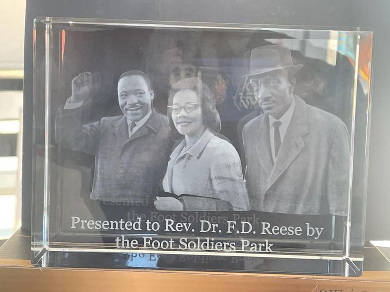 A glass plaque awarded to the family of F.D. Reese