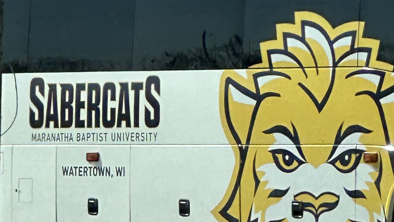 A bus for Maranatha Baptist University is parked outside Lucas Oil Stadium on March 4, 2023 during the NFL combine in Indianapolis. (Mike Rodak/AL.com)