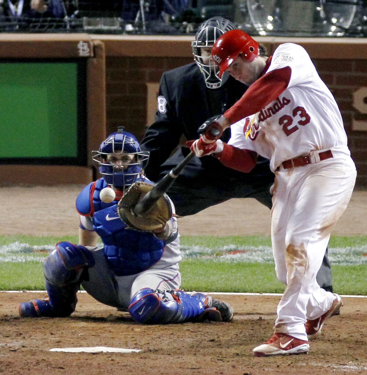 St. Louis Cardinals third baseman David Freese hits a home run