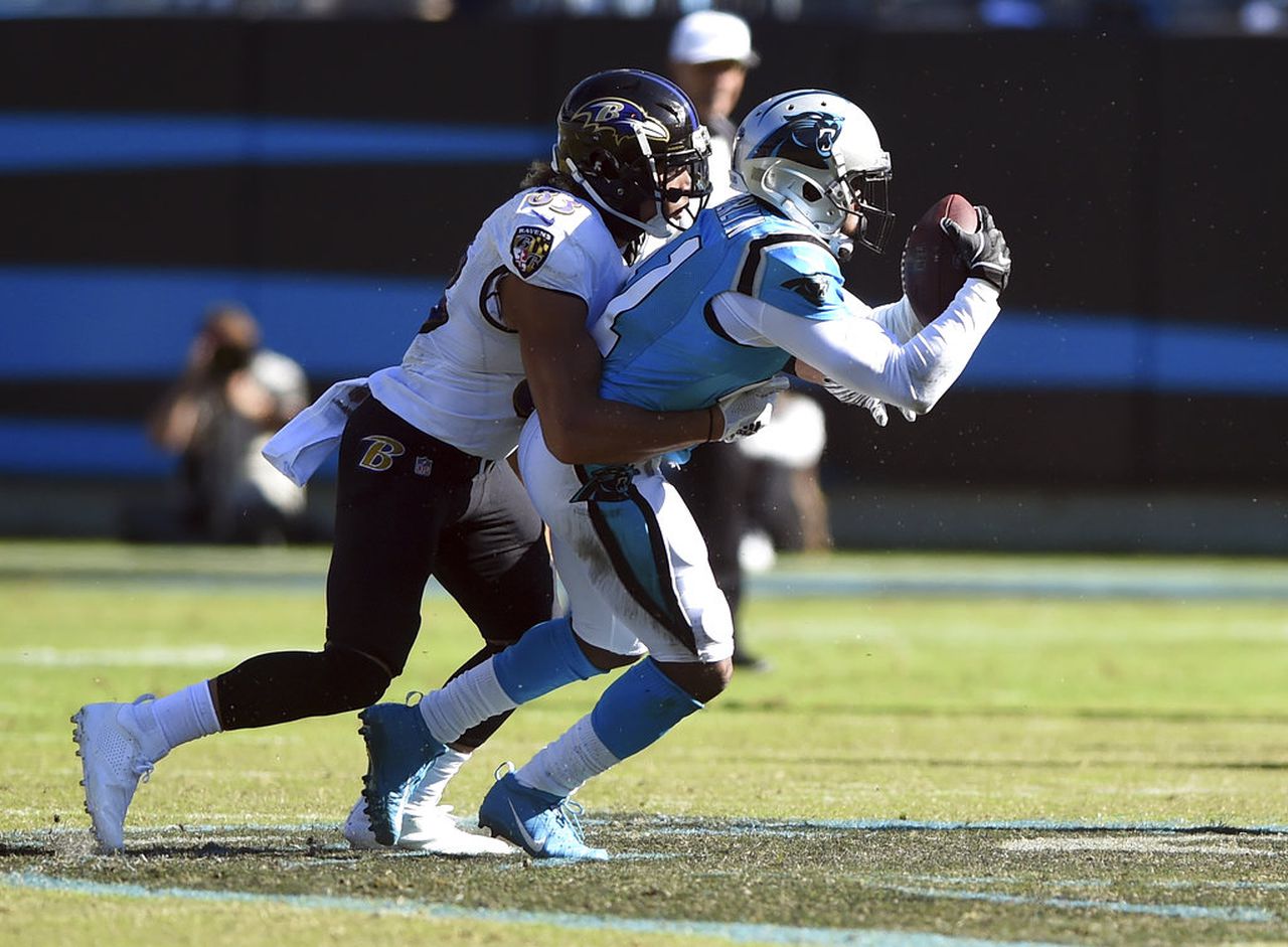 Carolina Panthers cornerback Captain Munnerlyn intercepts a pass