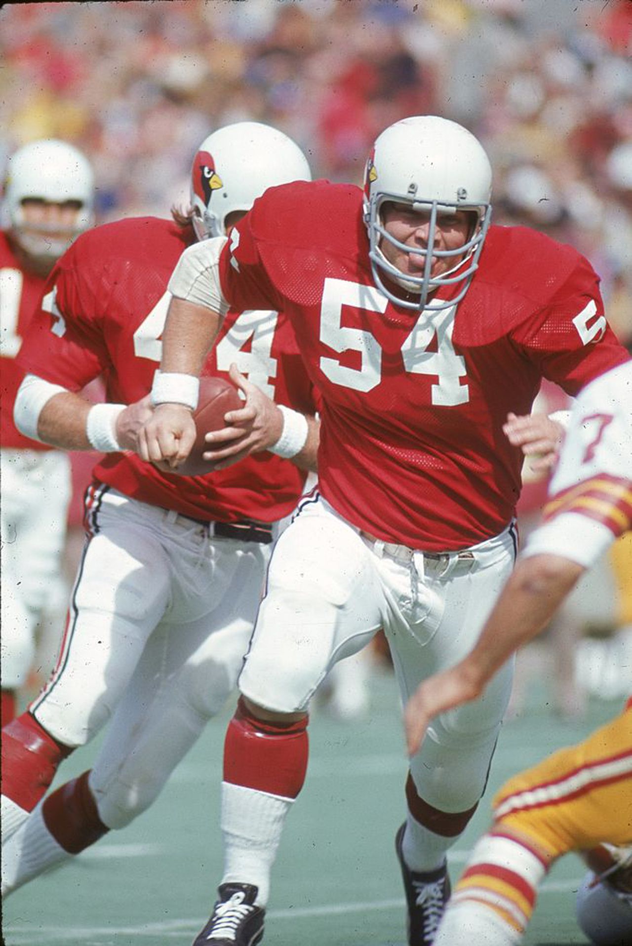 St. Louis Cardinals center Tom Banks leads running back Donny Anderson