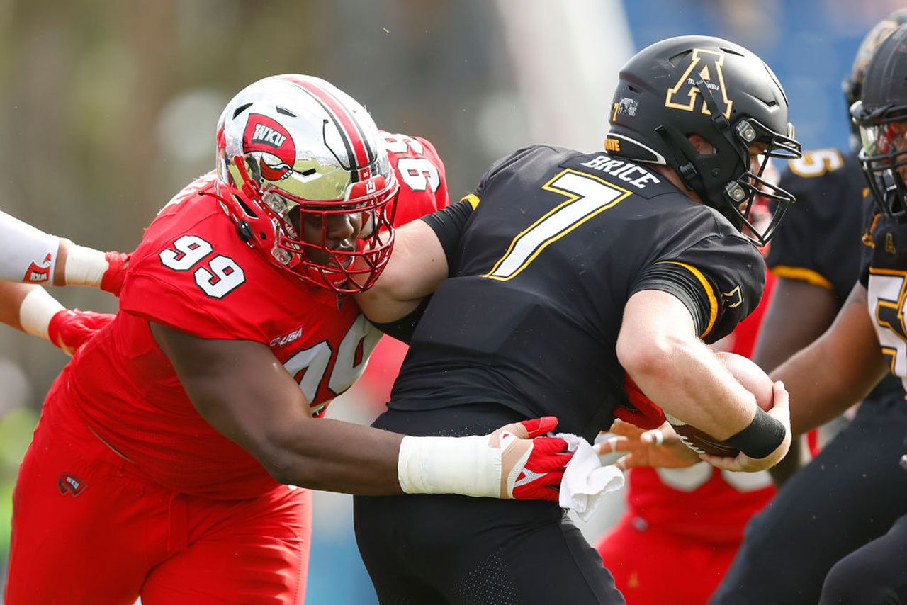 Western Kentucky nose tackle Brodric Martin sacks Appalachian State quarterback Chase Brice