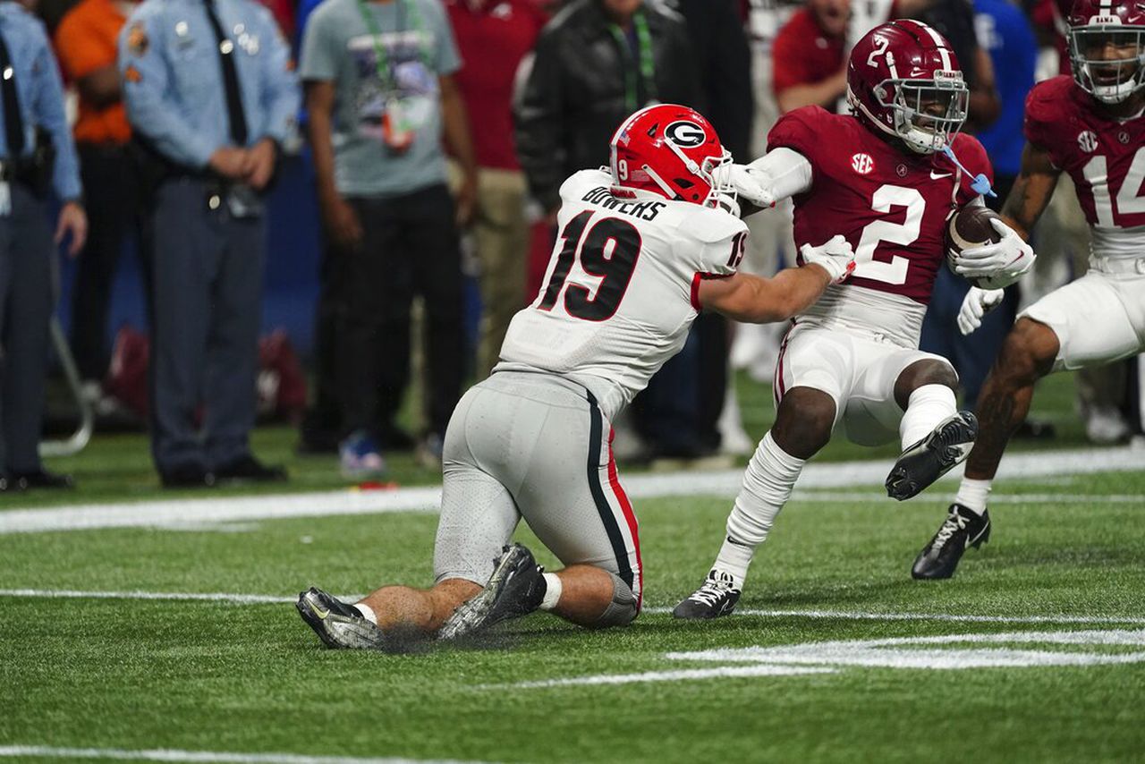 Alabama safety DeMarcco Hellams intercepts a pass