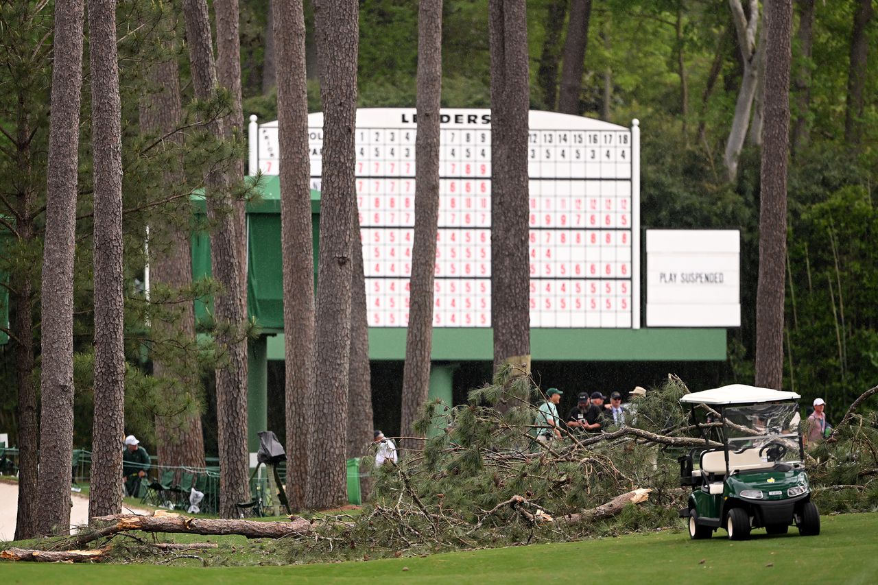 Watch large tree fall at Masters; 2nd round suspended