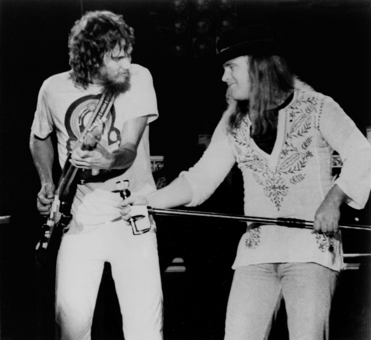 Lynyrd Skynyrd lead singer Ronnie Van Zant urges on guitarist Steve Gaines during a performance at Convention Hall in Asbury Park, New Jersey, July 20, 1977.