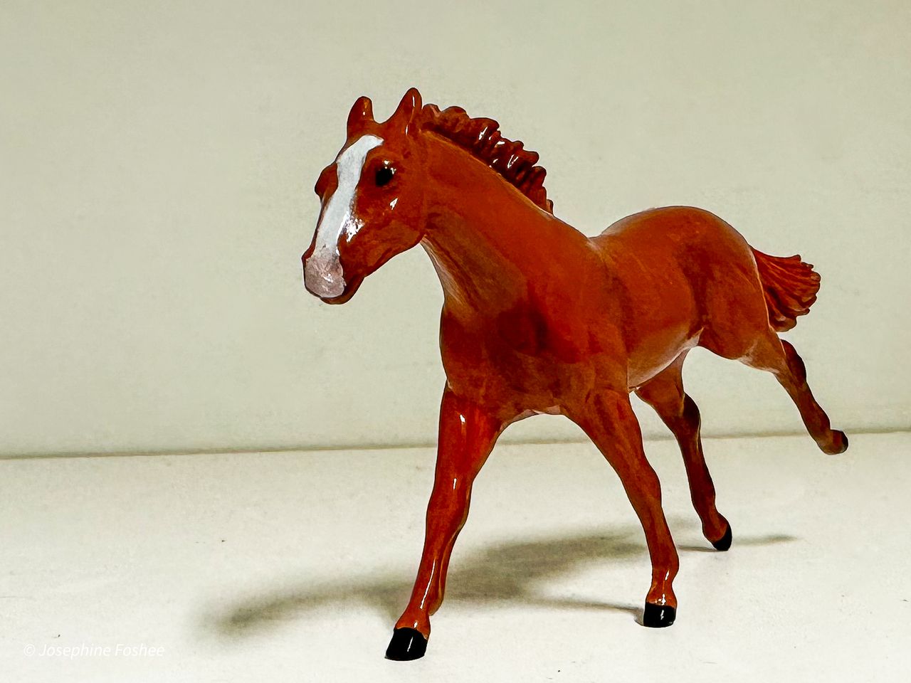 A Breyer model painted by Josephine Foshee to look like the thoroughbred race horse Mage.