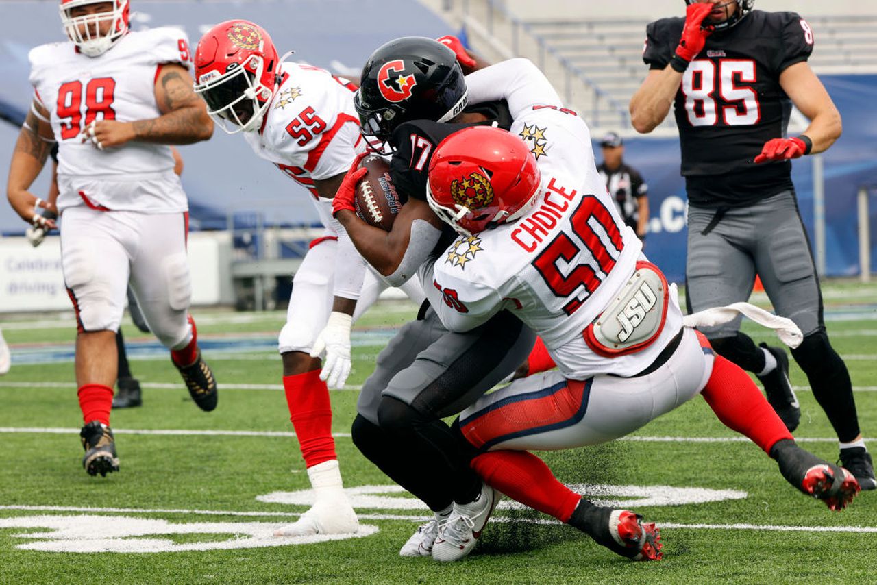 New Jersey Generals linebacker Jalen Choice tackles Houston Gamblers wide receiver Justin Hall