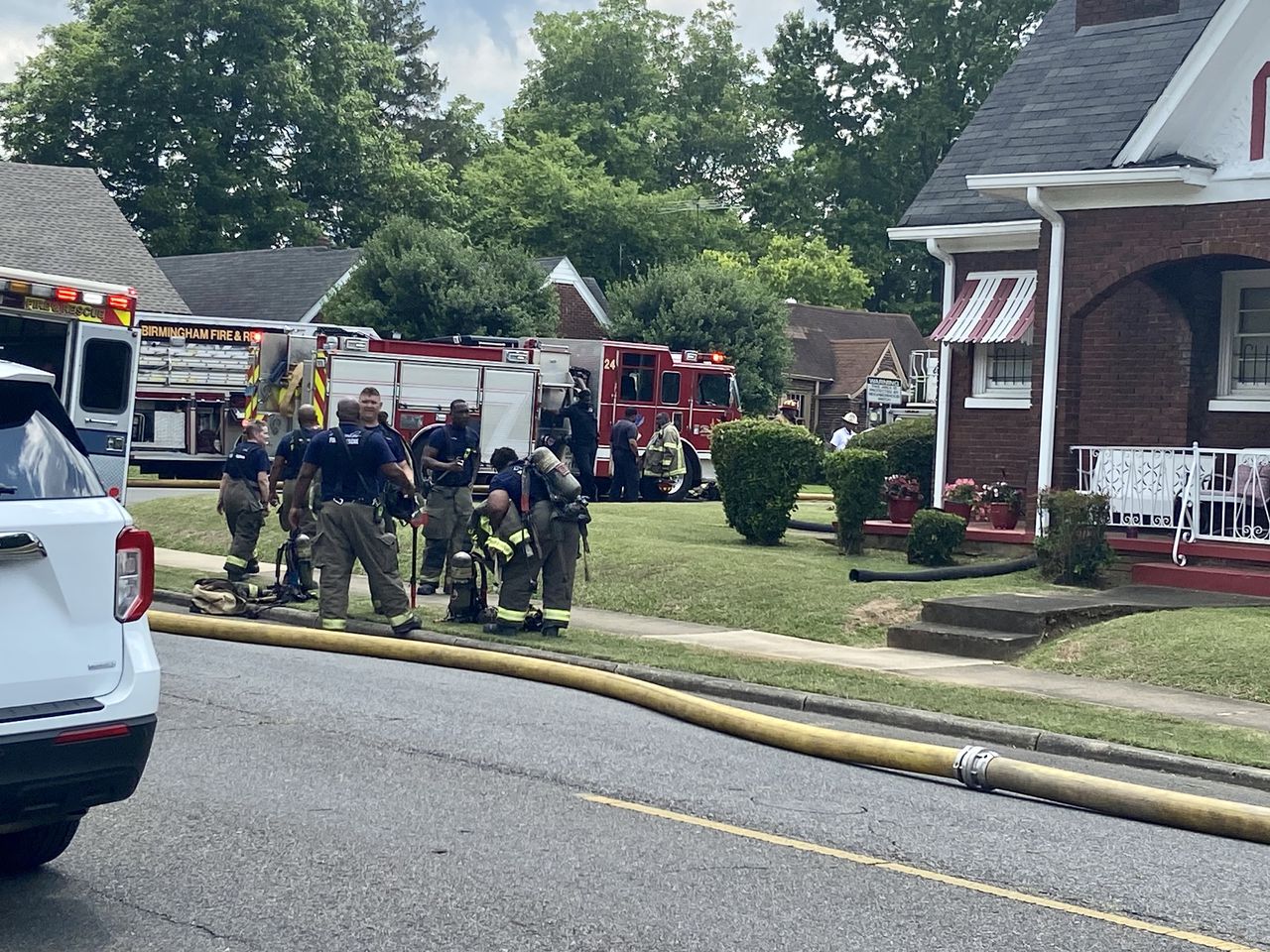 Woman pulled from burning home by Birmingham firefighters, hospitalized with serious injuries