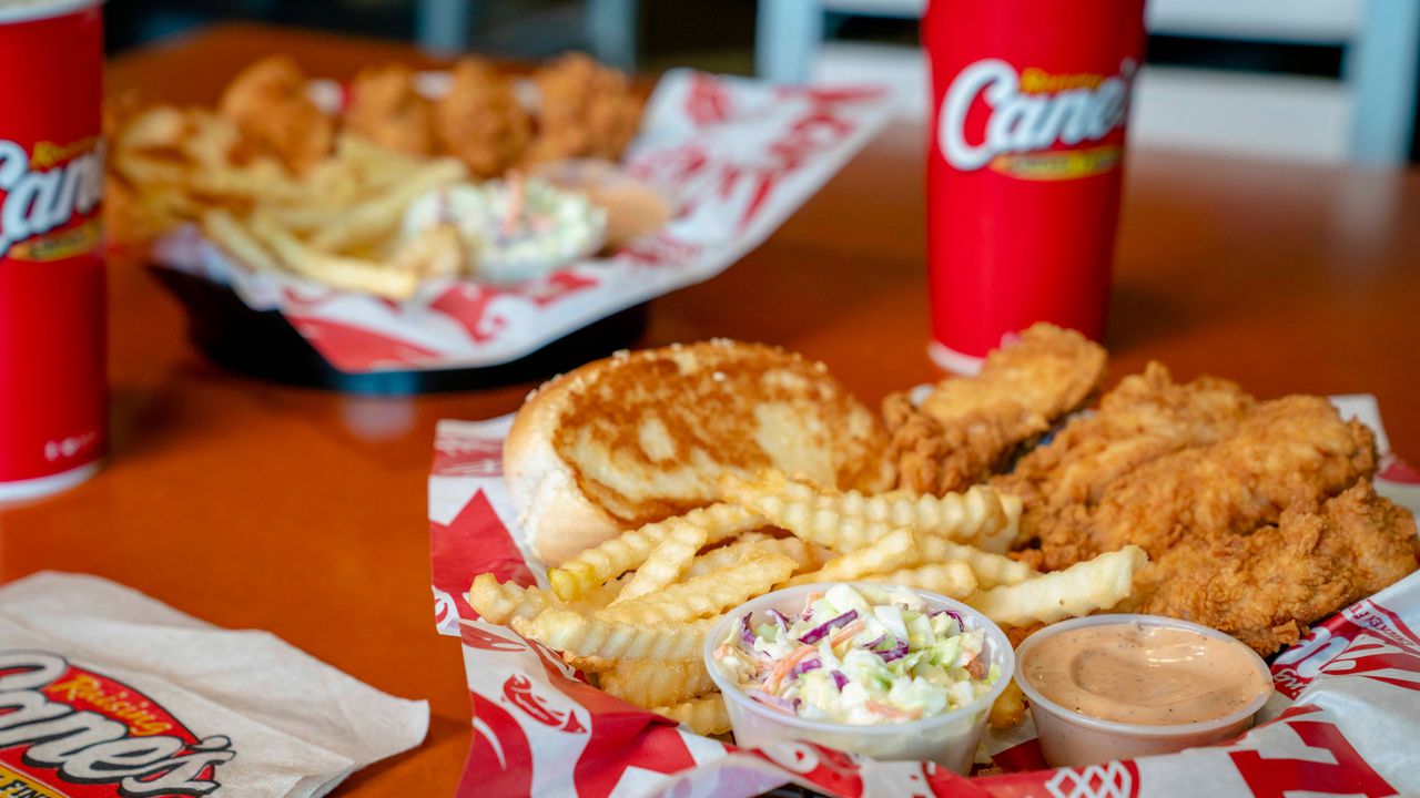 Check out Raising Caneâs opening in Times Square with Texas toast couches, sauce tables