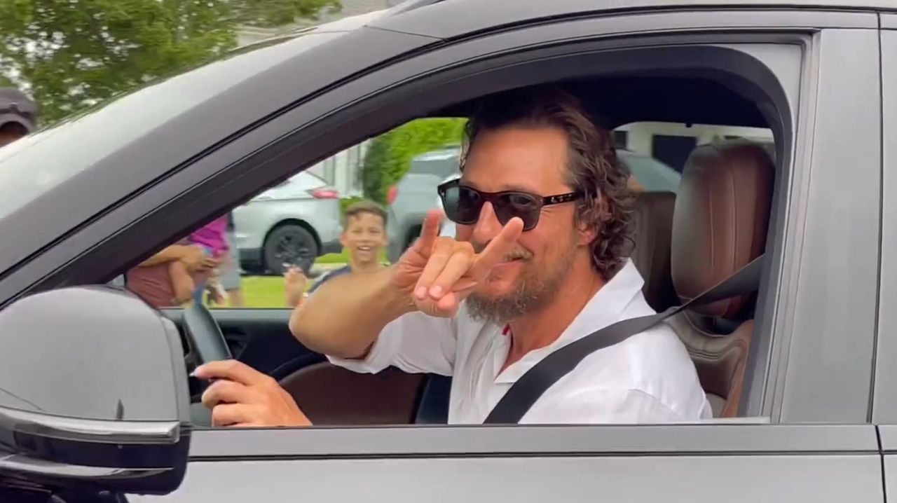 Matthew McConaughey throws horns up to fans during movie shoot in Pell City