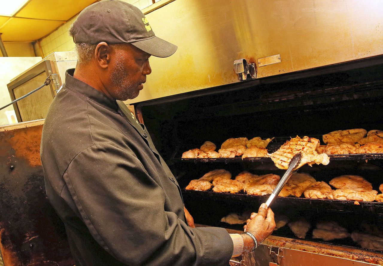 Owner Elbert Winfield tends to business in the kitchen at Saucy-Q Bar B Q on Government Street in Mobile, Ala. (Mike Brantley/mbrantley@al.com)