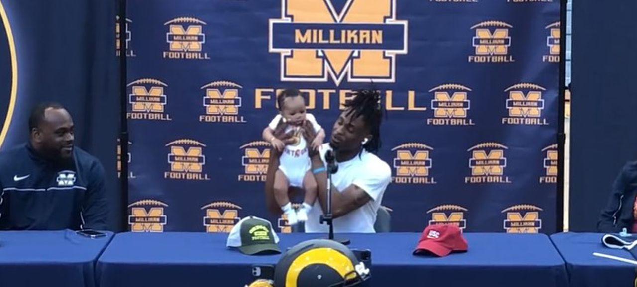 Recruit dresses his baby in USC Trojans gear to announce college commitment