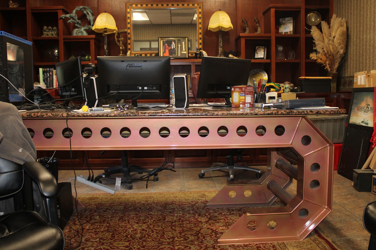 When you've got industrial equipment to play with, you might give yourself an office desk like this one, built as heavily as one of Silver Ships' vessels.