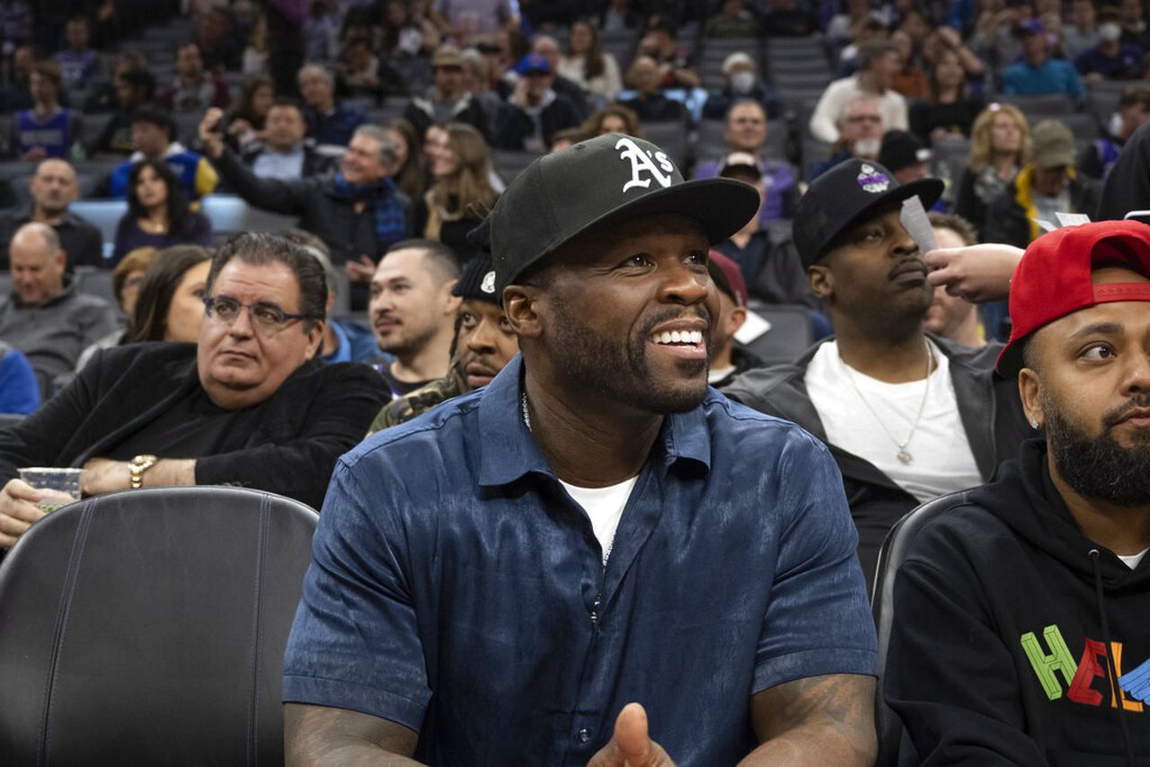 50 cent faces criminal battery after throwing mic, hitting fan