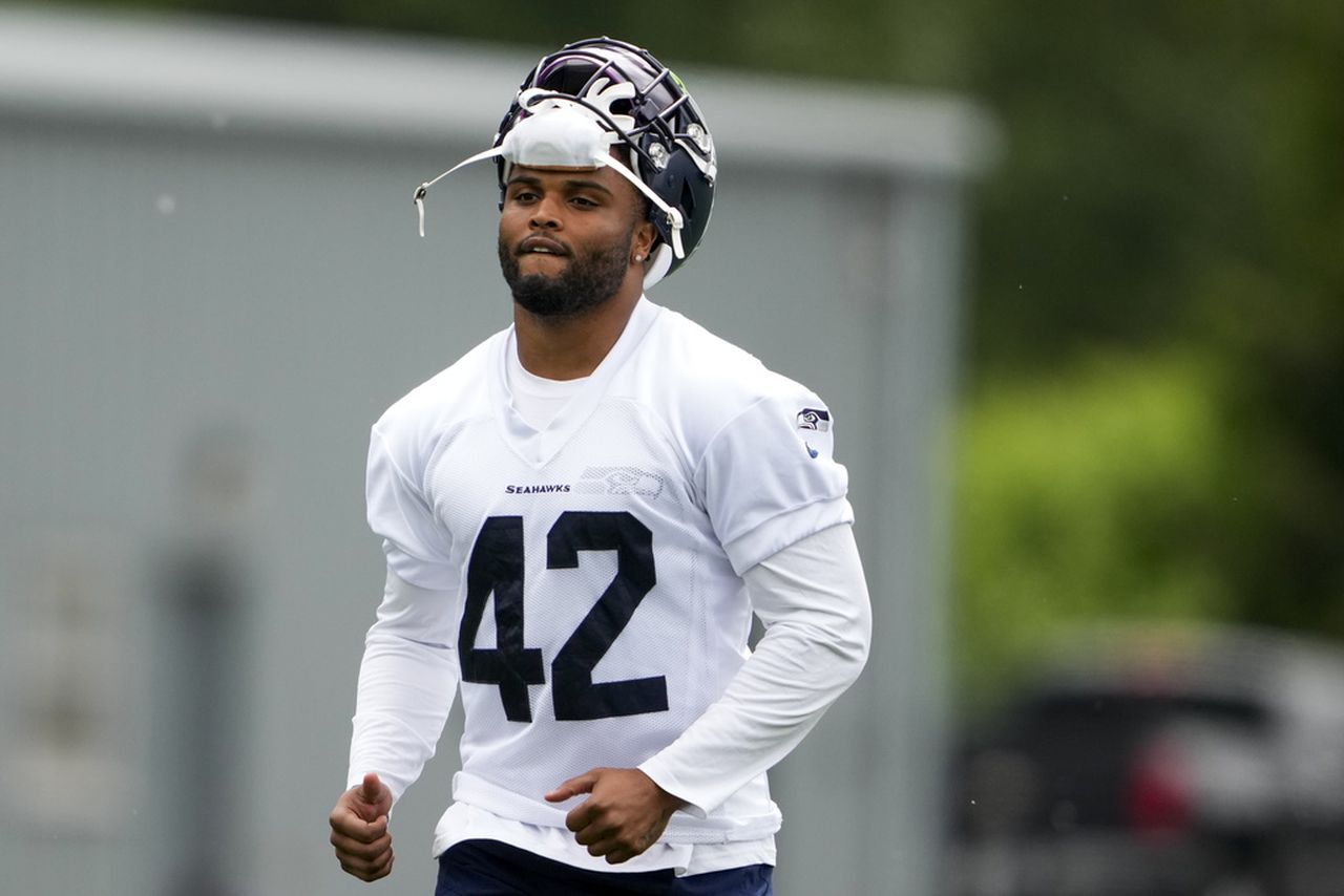 Seattle Seahawks linebacker Cam Bright jogs off the field after practice