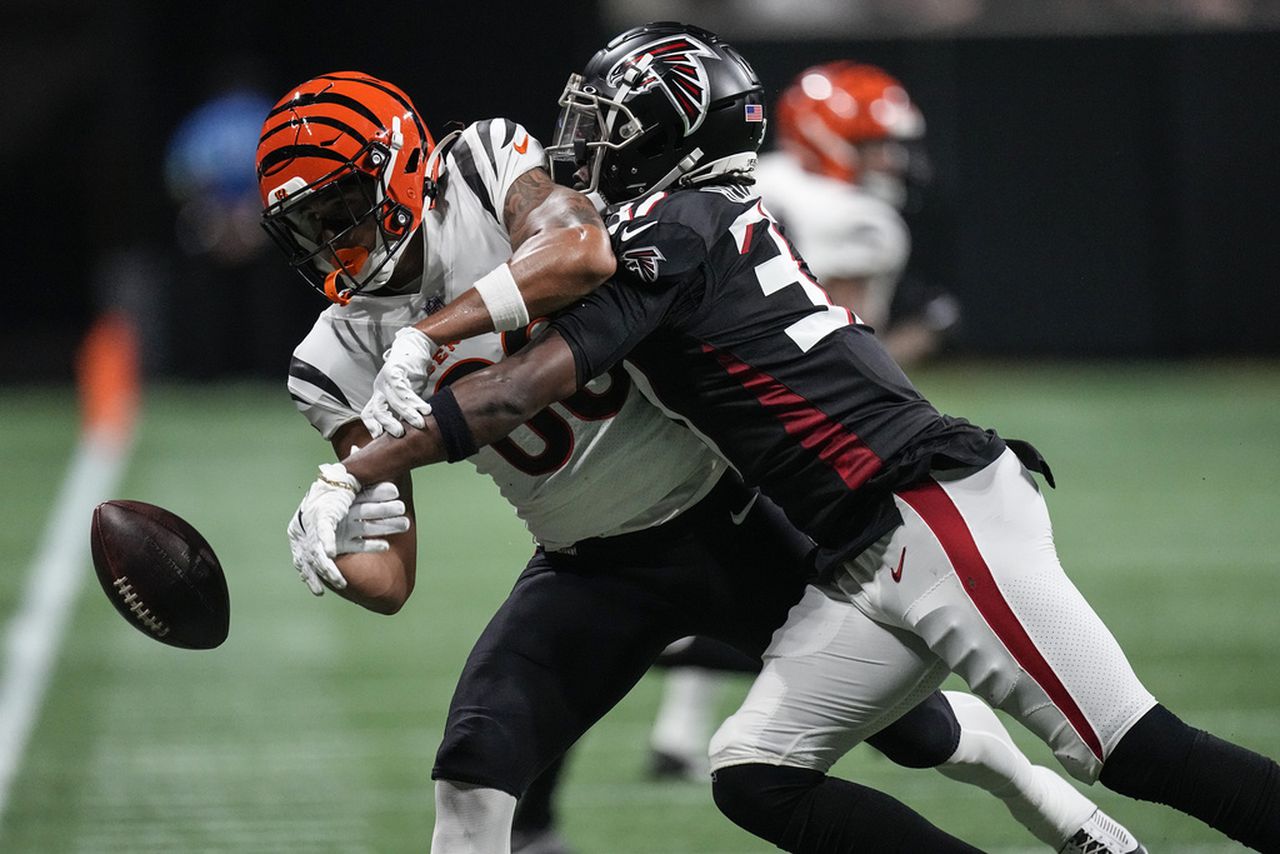 Atlanta Falcons safety DeMarcco Hellams breaks up a pass to Cincinnati Bengals wide receiver Andrei Iosivas