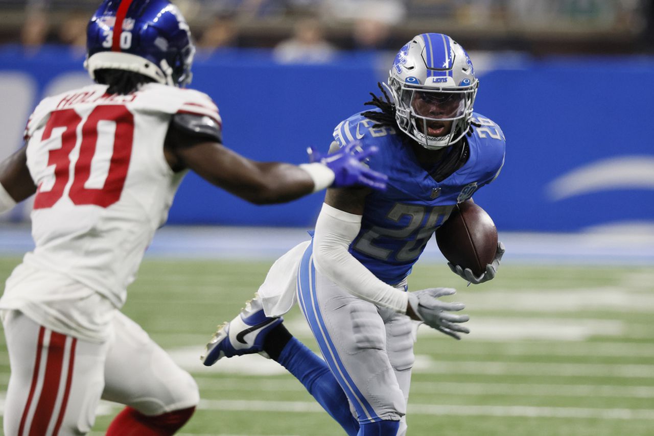Detroit Lions running back Jahmyr Gibbs carries the football