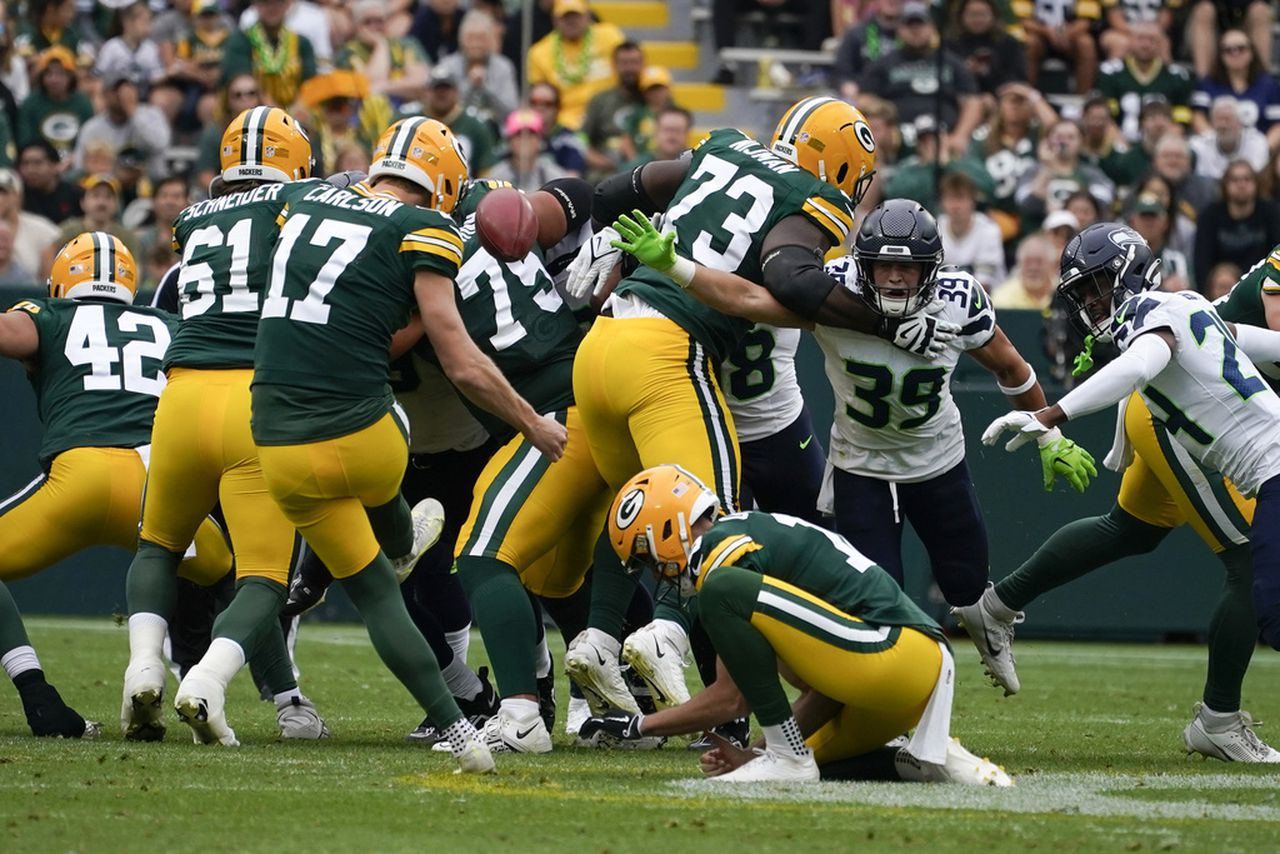 Anders Carlson of the Green Bay Packers kicks a 57-yard field goal