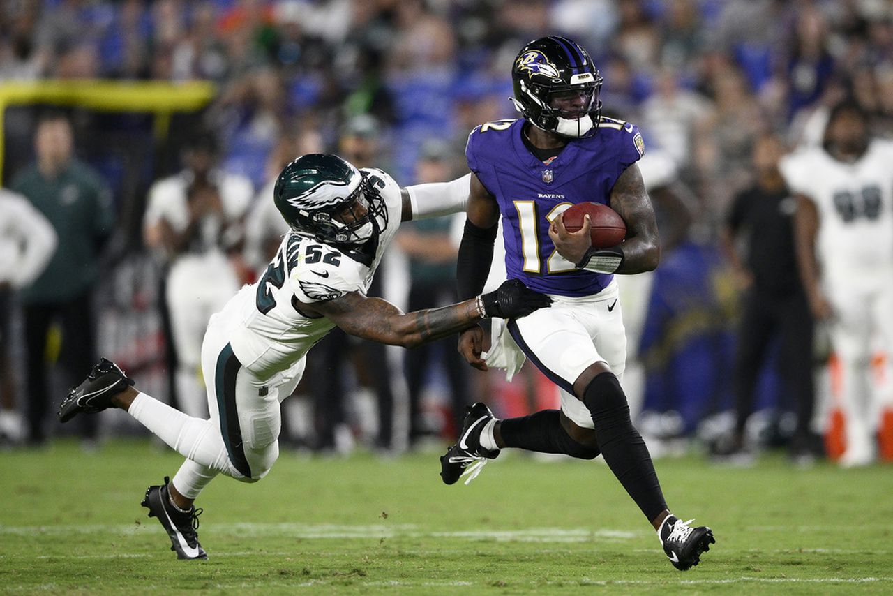 Philadelphia Eagles linebacker Zach Cunningham grabs Baltimore Ravens quarterback Anthony Brown