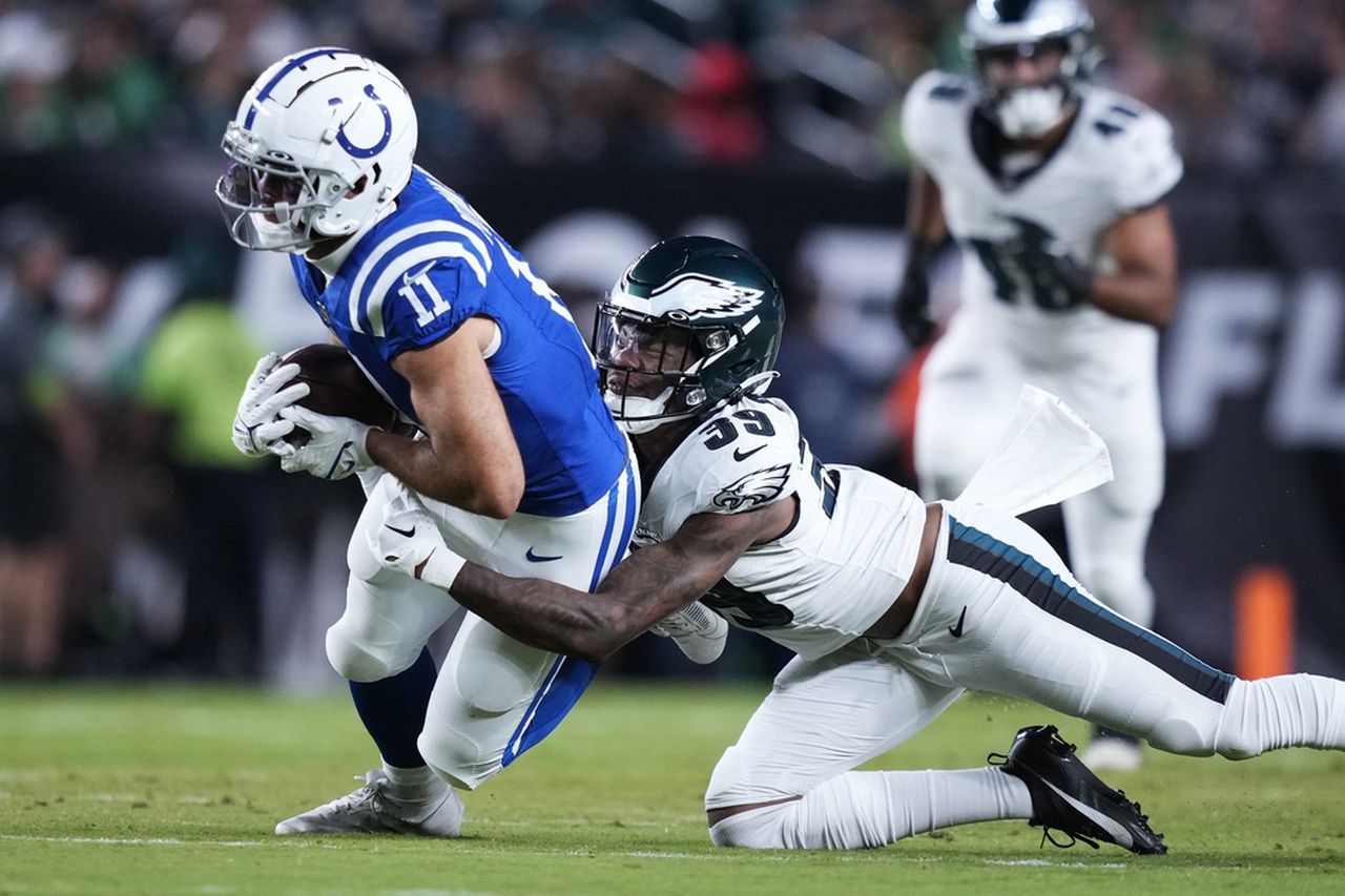 Philadelphia Eagles cornerback Eli Ricks tackles Indianapolis Colts wide receiver Michael Pittman Jr.