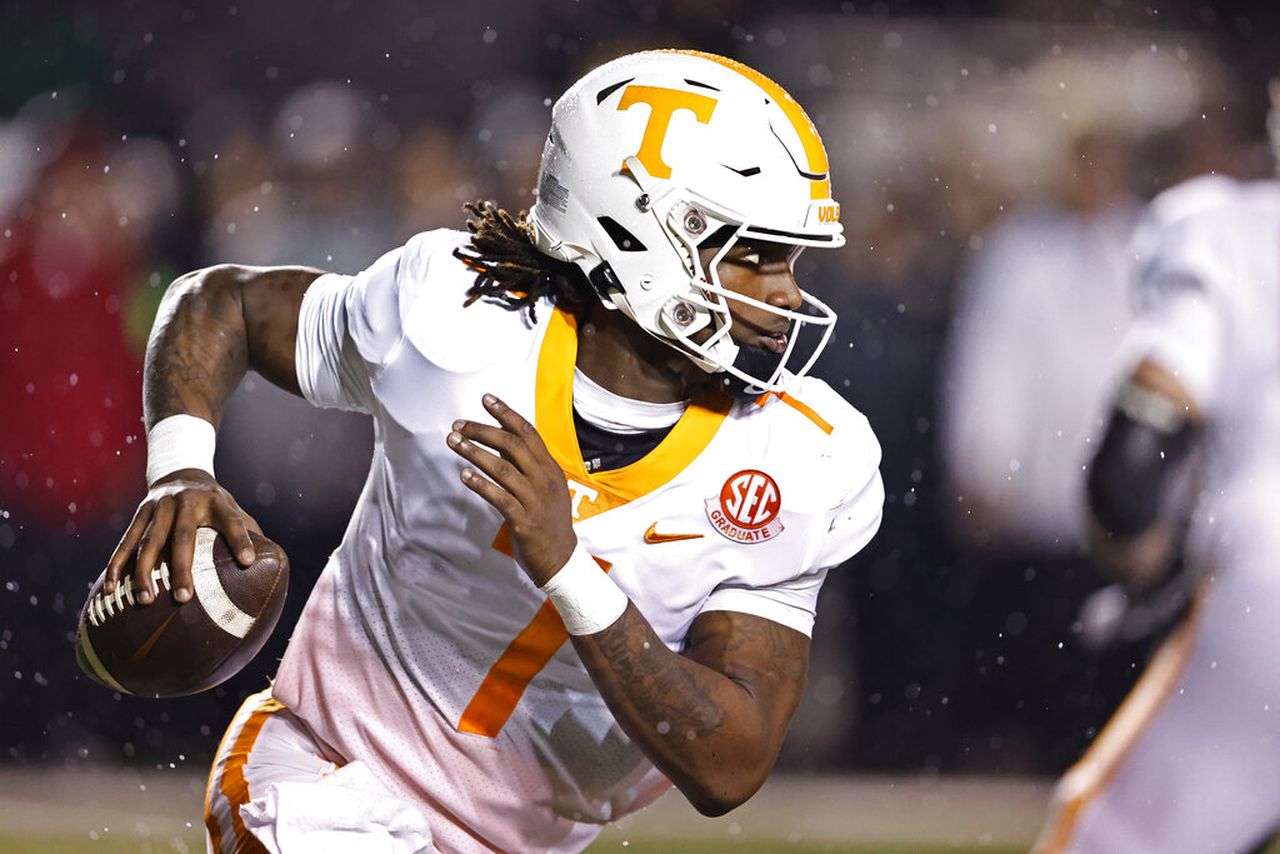 Tennessee quarterback Joe Milton III rolls out