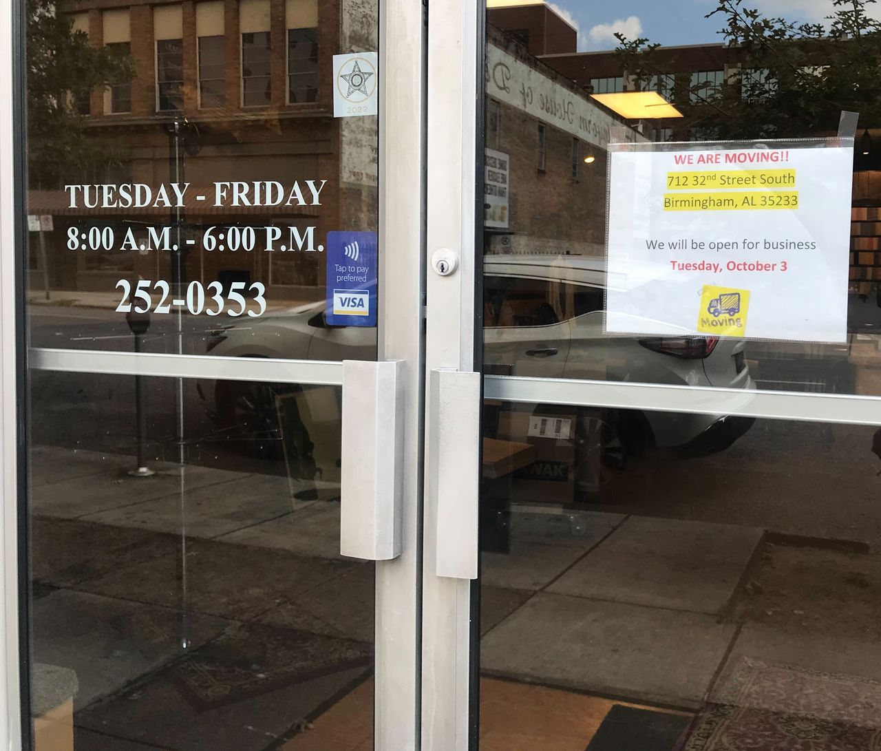 Moving sign at Robert Hill Custom Tailors