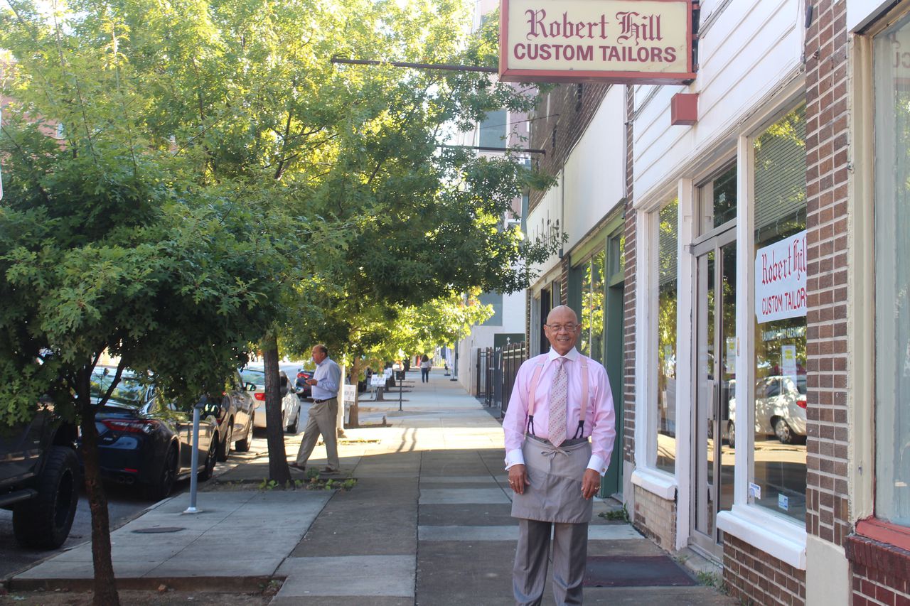 Tailor Robert Hill outside of his shop