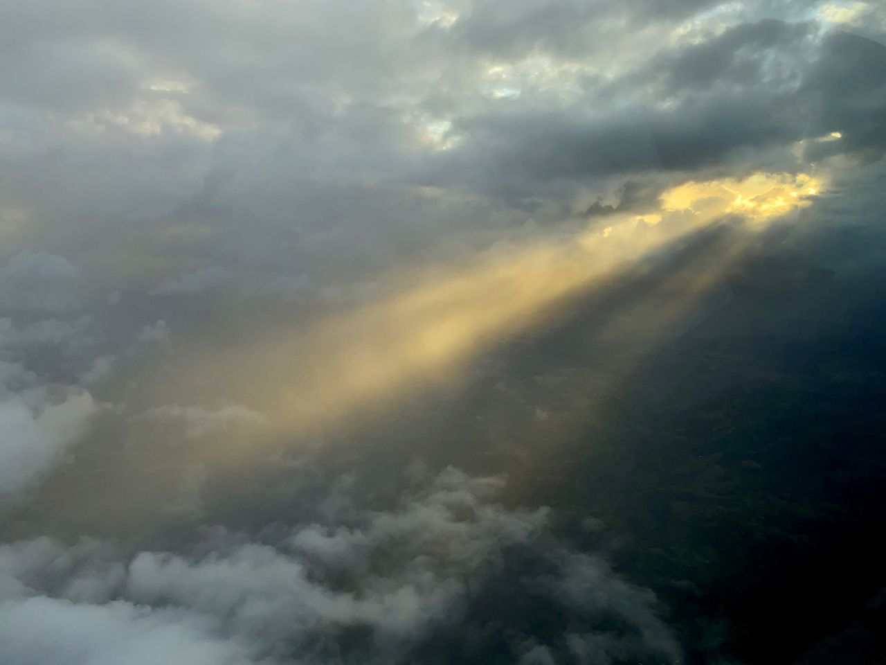 Late afternoon clouds and sun from an airplane