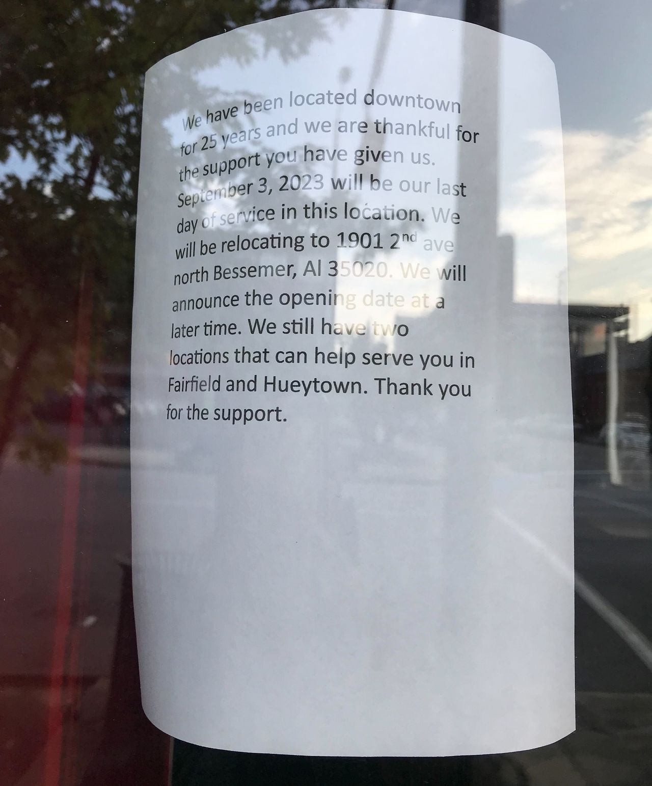 A sign on the front door of Magic City Grill