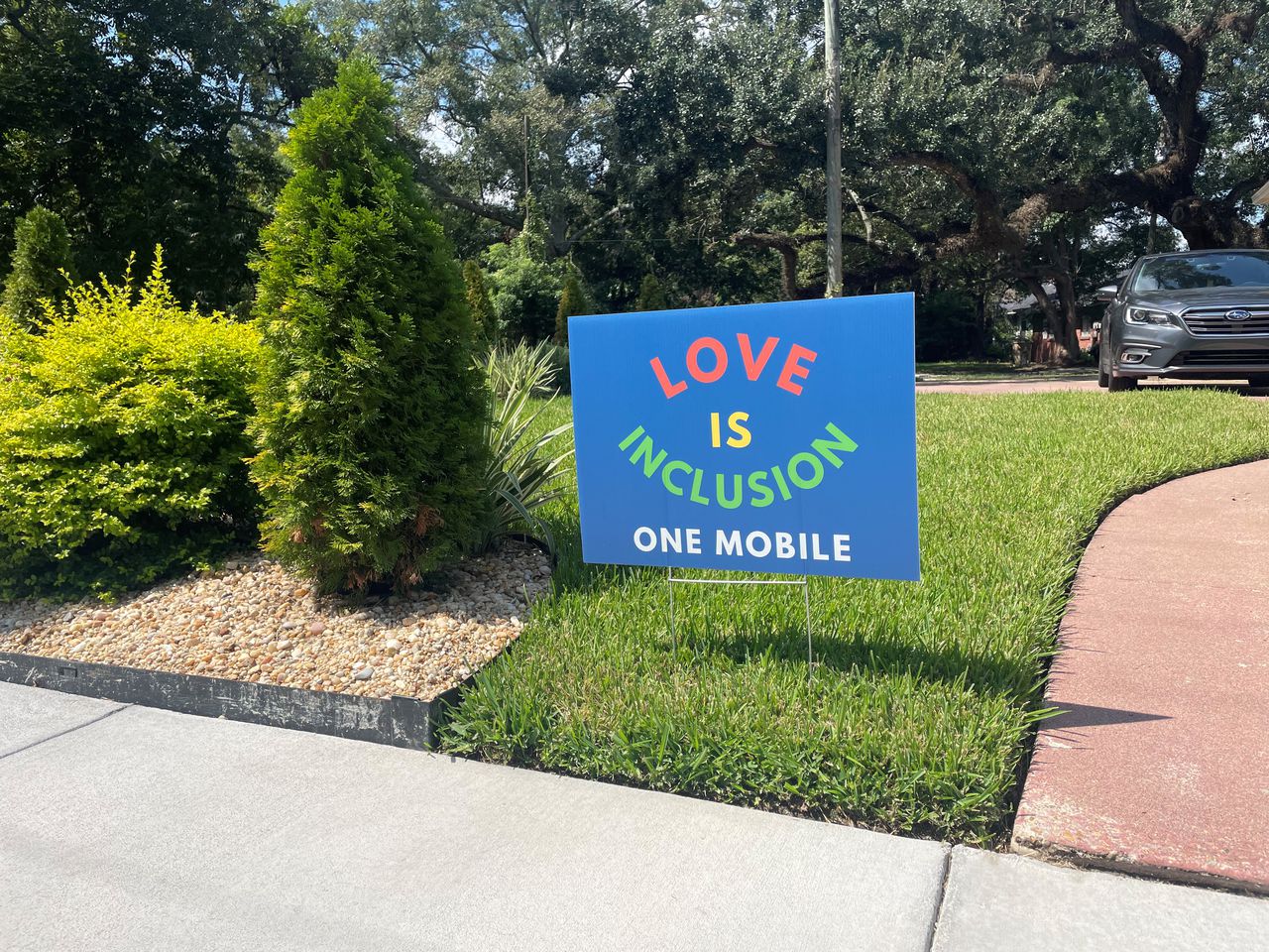 Mobile residents tout âLove is Inclusionâ signs as counter to anti-LGBTQ rhetoric