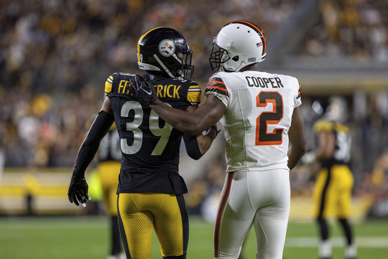 Pittsburgh Steelers safety Minkah Fitzpatrick and Cleveland Browns wide receiver Amari Cooper talk after a play