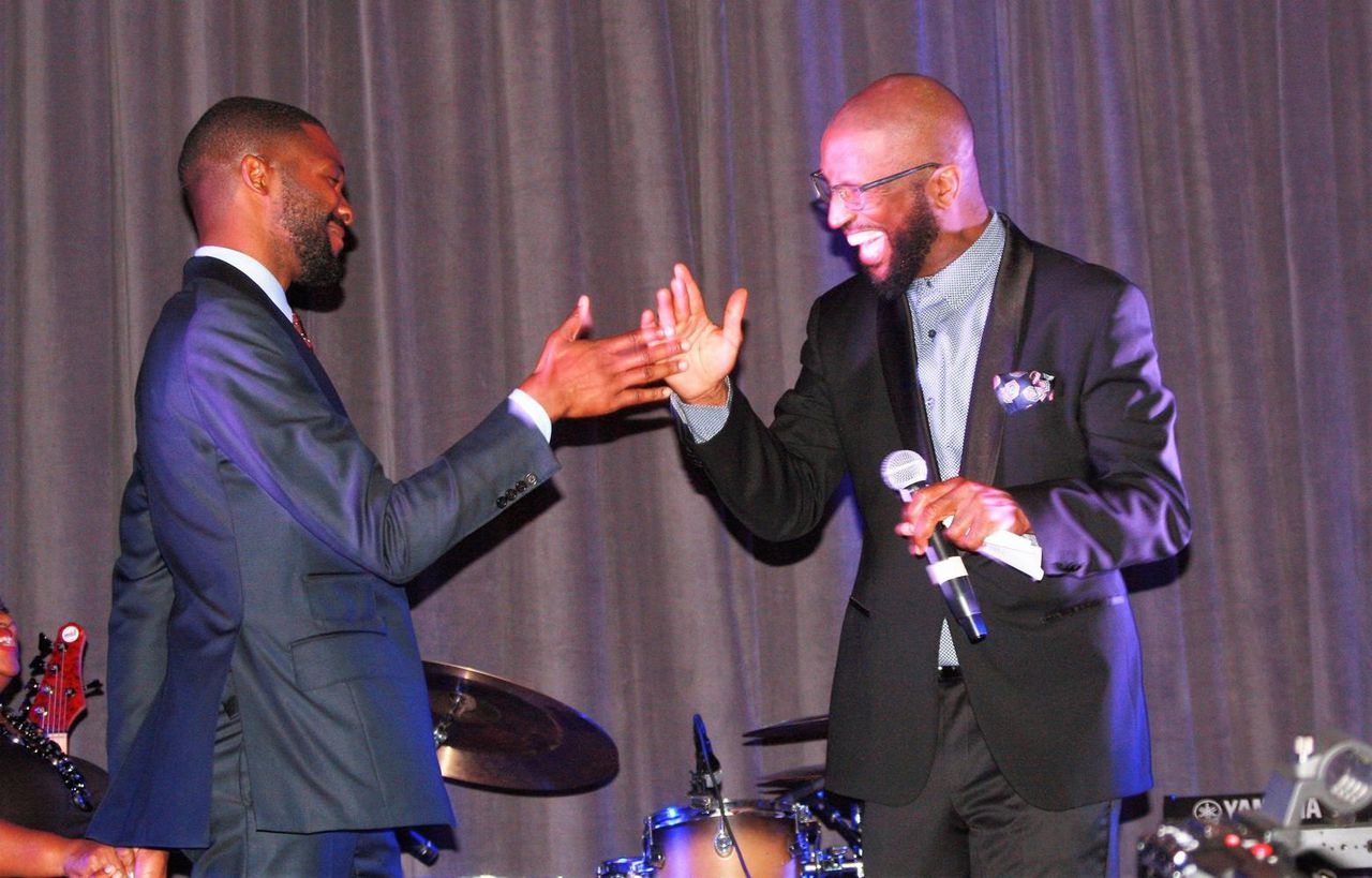 Woodfin and comedian Ricky Smiley at reception for inauguration