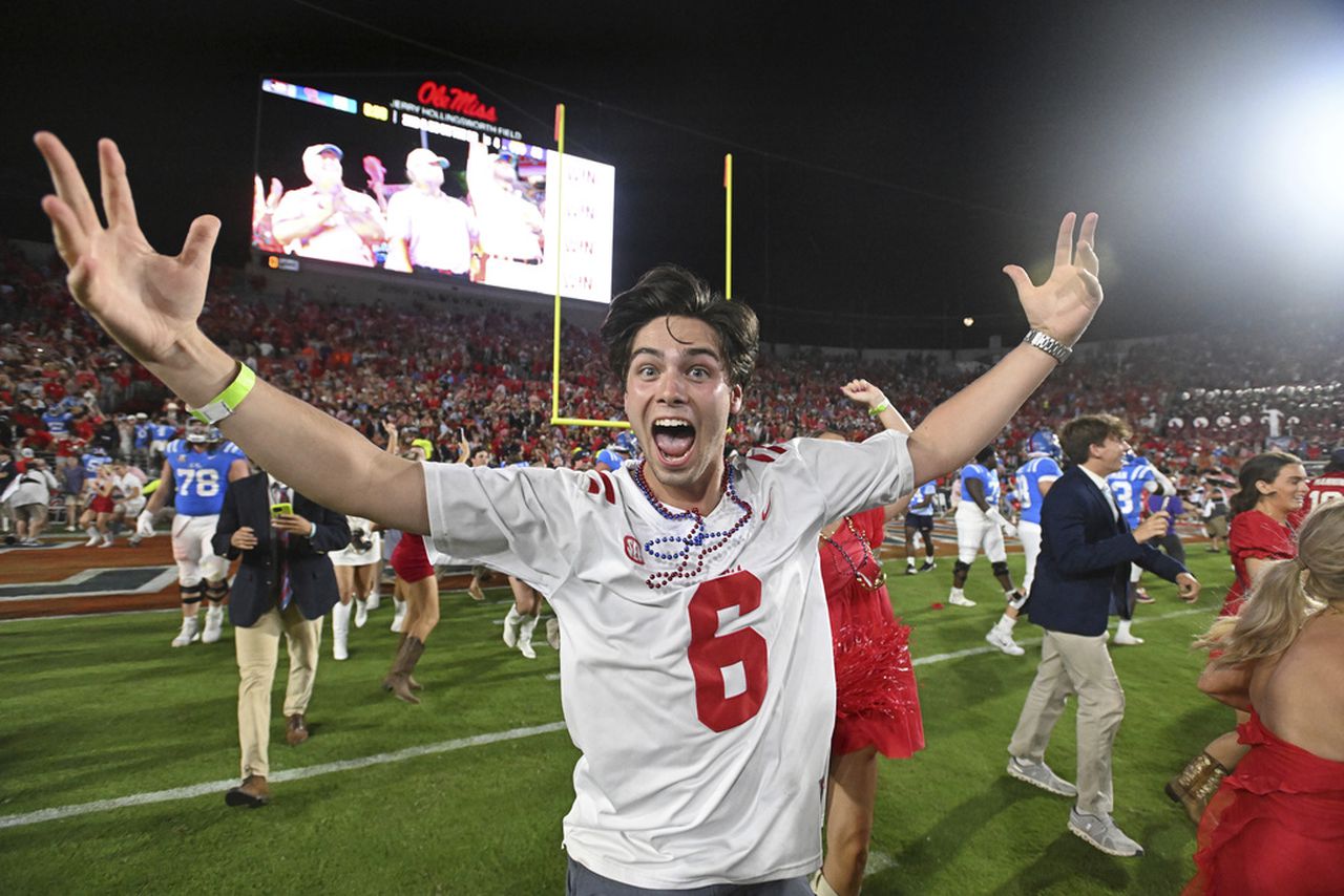 Ole Miss fined for storming field; Video shows security guard hits girl, LSU player decks fan