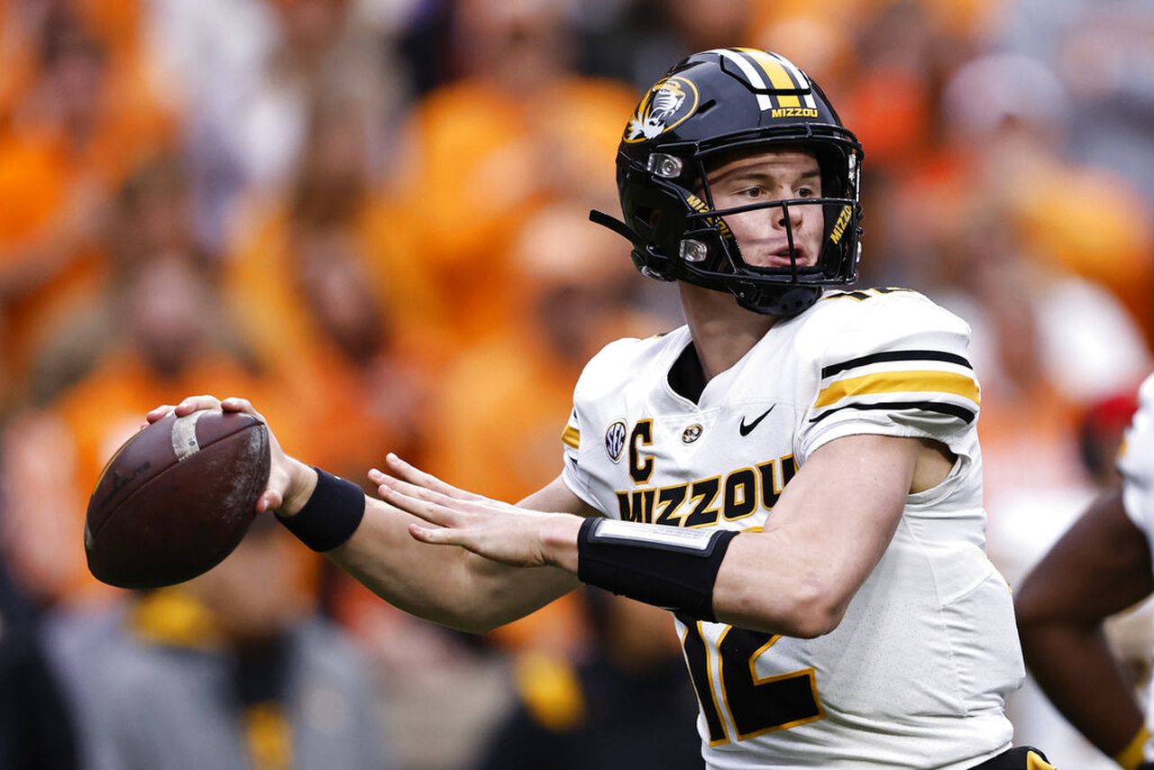 Missouri quarterback Brady Cook passes during an SEC game against Tennessee