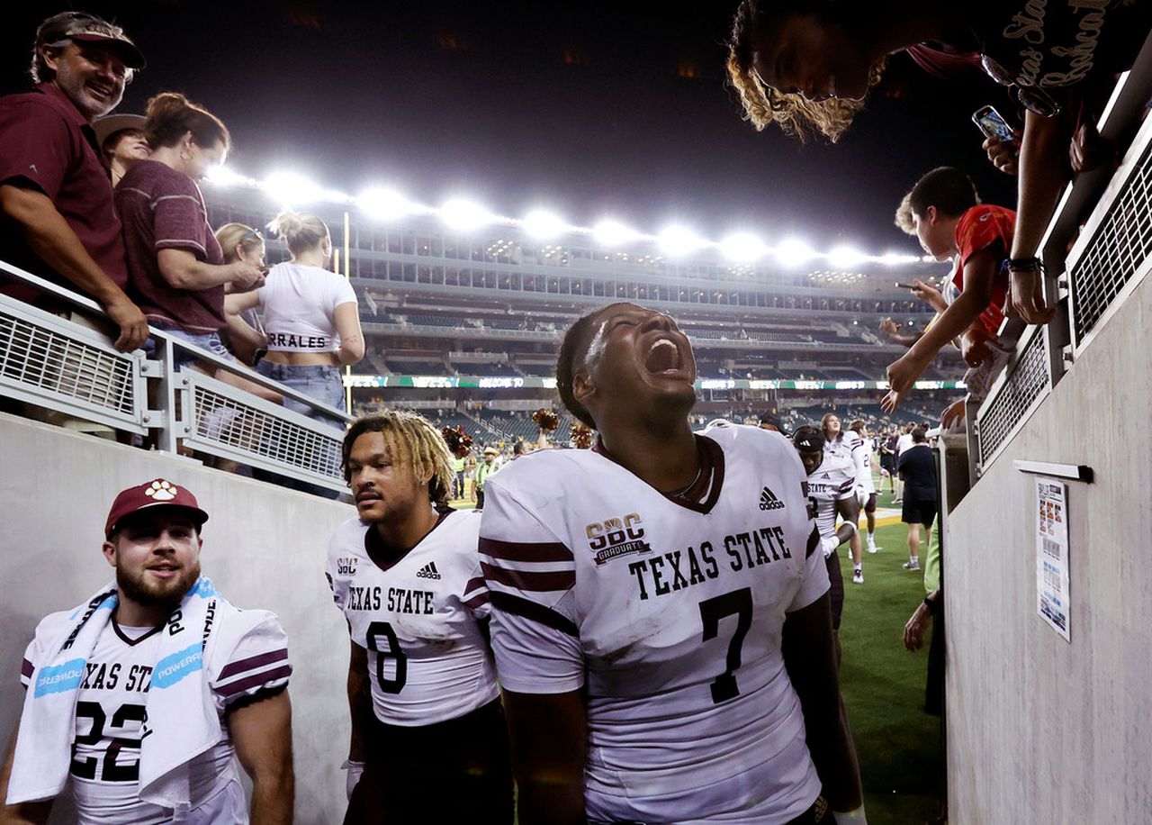 Texas State quarterback TJ Finley (7) celebrates as he enters the tunnel after defeating Baylor in an NCAA college football game, Saturday, Sept. 3, 2023, in Waco, Texas. (Jerry Larson/Waco Tribune-Herald via AP)