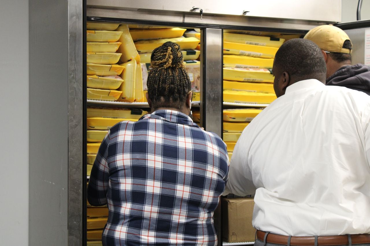 Pastor Richard Williams, of the Metropolitan United Methodist Church in Montgomery, Alabama, assesses donations at the Beacon Center, a food pantry and resource center operated by the church. The center opened in 2022 and says it is seeing an increasing number of families ask for help finding food.