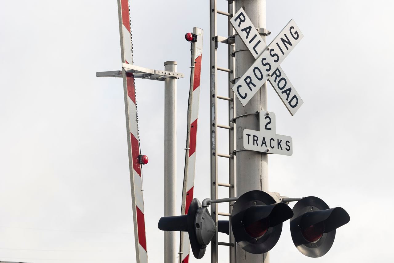 Cranes working on Calera train derailment, blocked railroad crossing