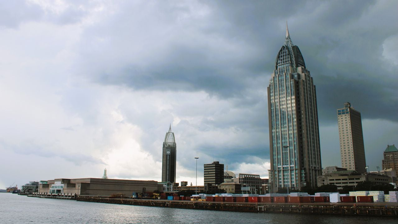 The Mobile skyline is seen from up the Mobile River as storms move through the area on July 7, 2023.