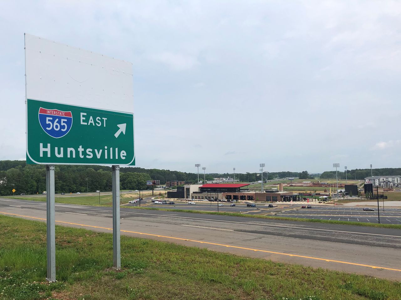 What is the schedule for widening of I-565 east past the Huntsville International Airport?